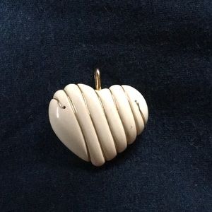 Cream/off white heart pendant.
